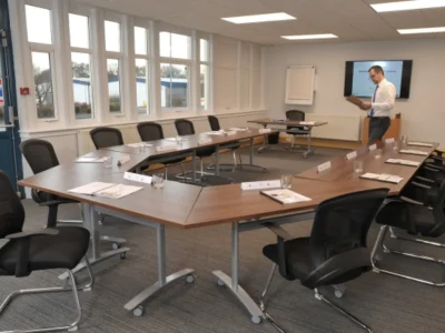 Man preparing a presentation in a conference room